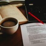 cup of coffee beside open book